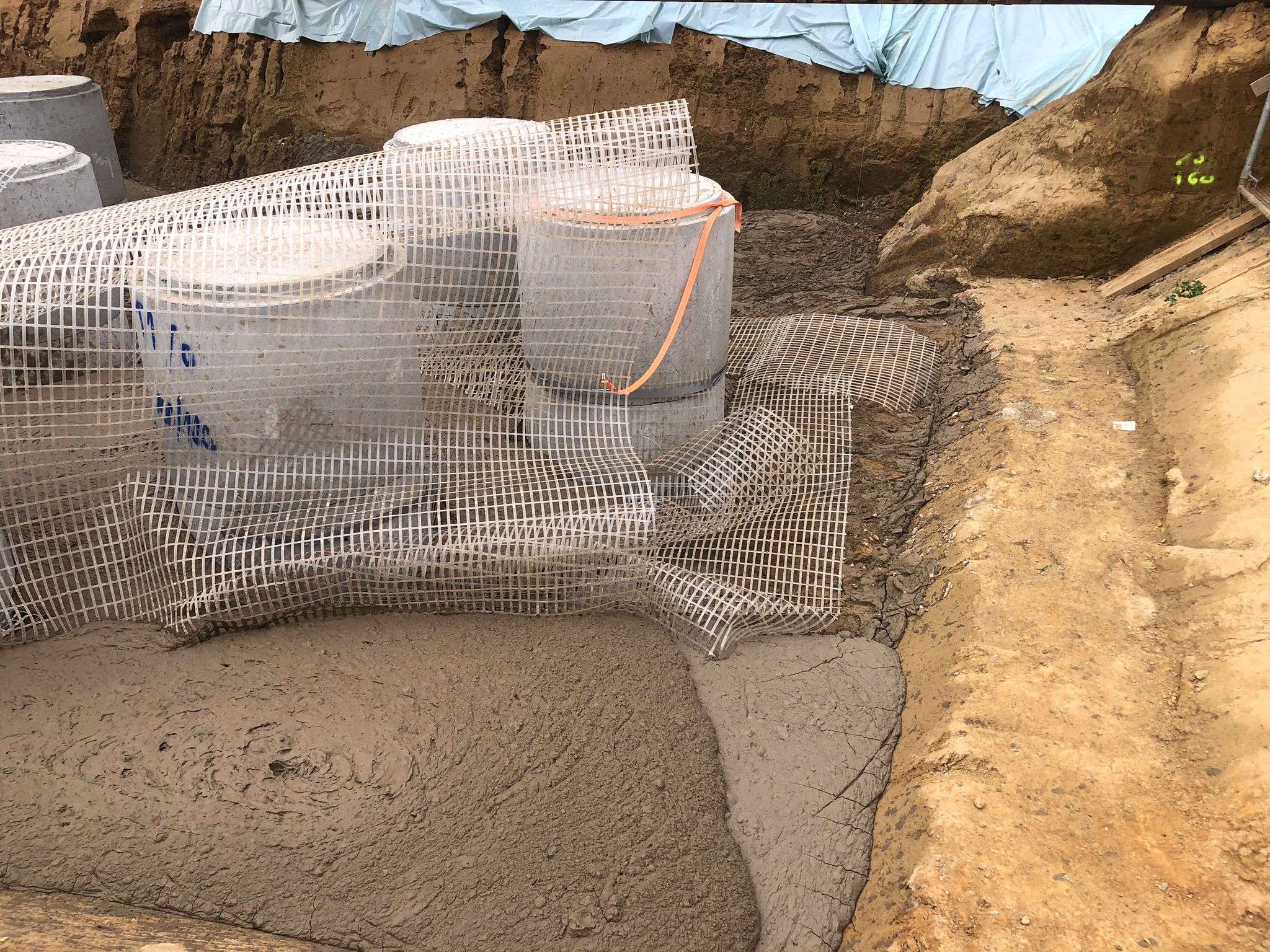 Verfüllung Geotextil und Flüssigboden Baugrube